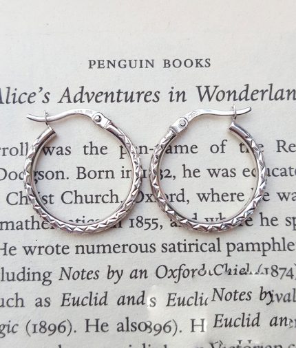White gold hoop earrings with a hammered finish