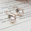 Victorian pearl earrings with a diamond adorned star
