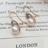 Victorian pearl earrings with a diamond adorned star