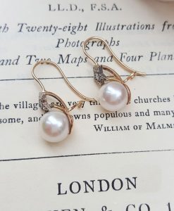 Victorian pearl earrings with a diamond adorned star