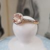 Morganite and diamond halo ring in a 9ct yellow gold setting