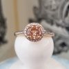 Morganite and diamond halo ring in a 9ct yellow gold setting