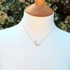 Crescent moon necklace in solid 9ct yellow gold with cubic zirconia
