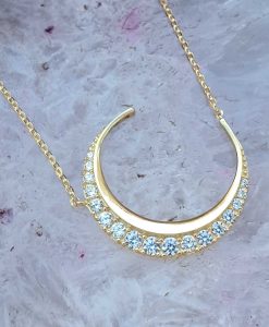 crescent moon necklace in solid 9ct yellow gold with cubic zirconia.