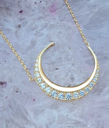 crescent moon necklace in solid 9ct yellow gold with cubic zirconia.