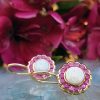 14ct yellow gold opal and ruby flower shaped drop earrings. Leaver back