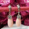 14ct yellow gold & pink coral drop earrings with diamonds and emeralds. Post & Butterfly