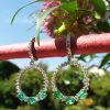 18ct white gold emerald and diamond dangly earrings