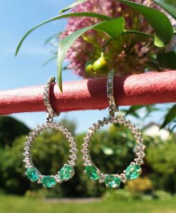 18ct white gold emerald and diamond dangly earrings