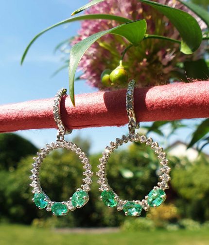 18ct white gold emerald and diamond dangly earrings