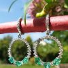 18ct white gold emerald and diamond dangly earrings