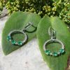18ct white gold emerald and diamond dangly earrings